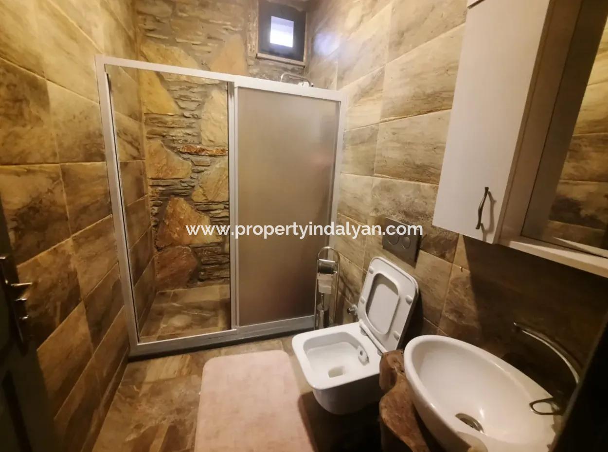 Muğla Dalyan Gökbelde Deniz Manzaralı, Yüzme Havuzlu, 1800 M2 Arazide 2+1  Eşyalı Taş Ev Satılık