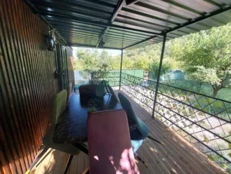 Ortaca Okçular’da 21 M² Eşyalı 1+1 Konteyner Ev – Yıllık Kiralık